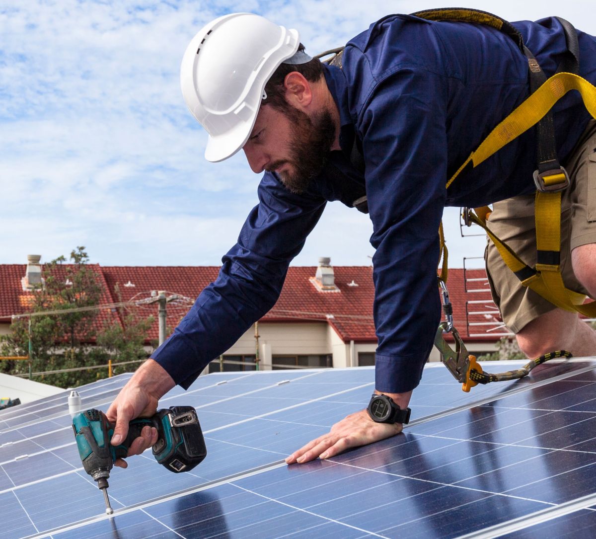 Worker on solar roof